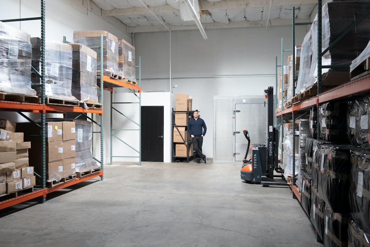 Warehouse shelves with organized inventory boxes representing ecommerce inventory turnover management