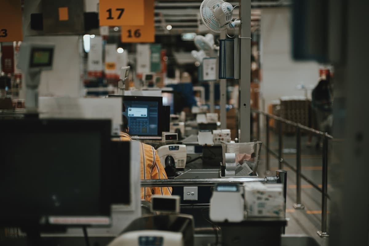Warehouse worker using barcode scanner to verify inventory accuracy during pick-pack operations
