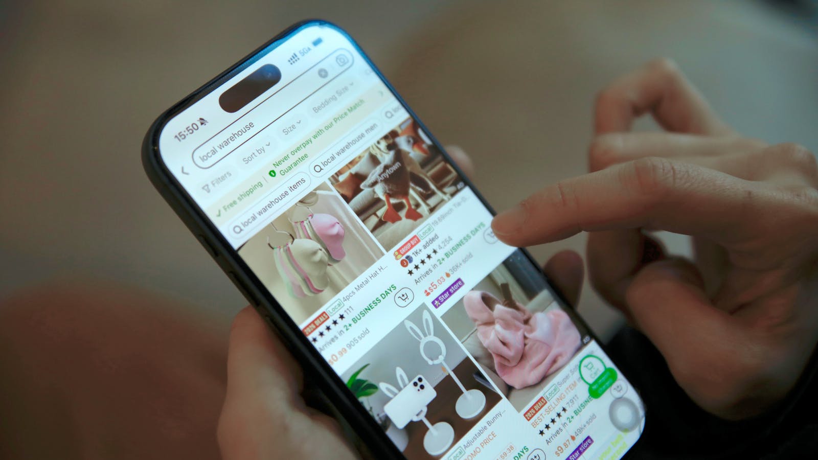 Smartphone browsing online products, representing AI shopping agents comparing ecommerce listings